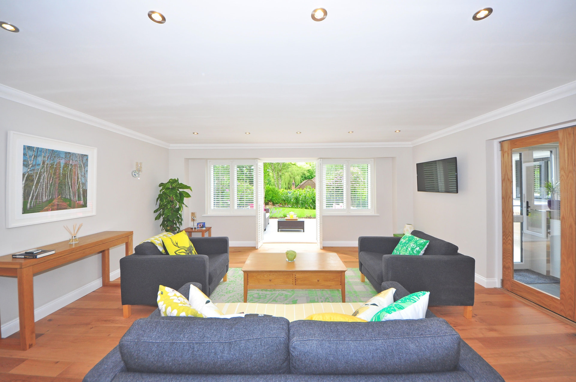 Bright, styled living room opening onto a garden