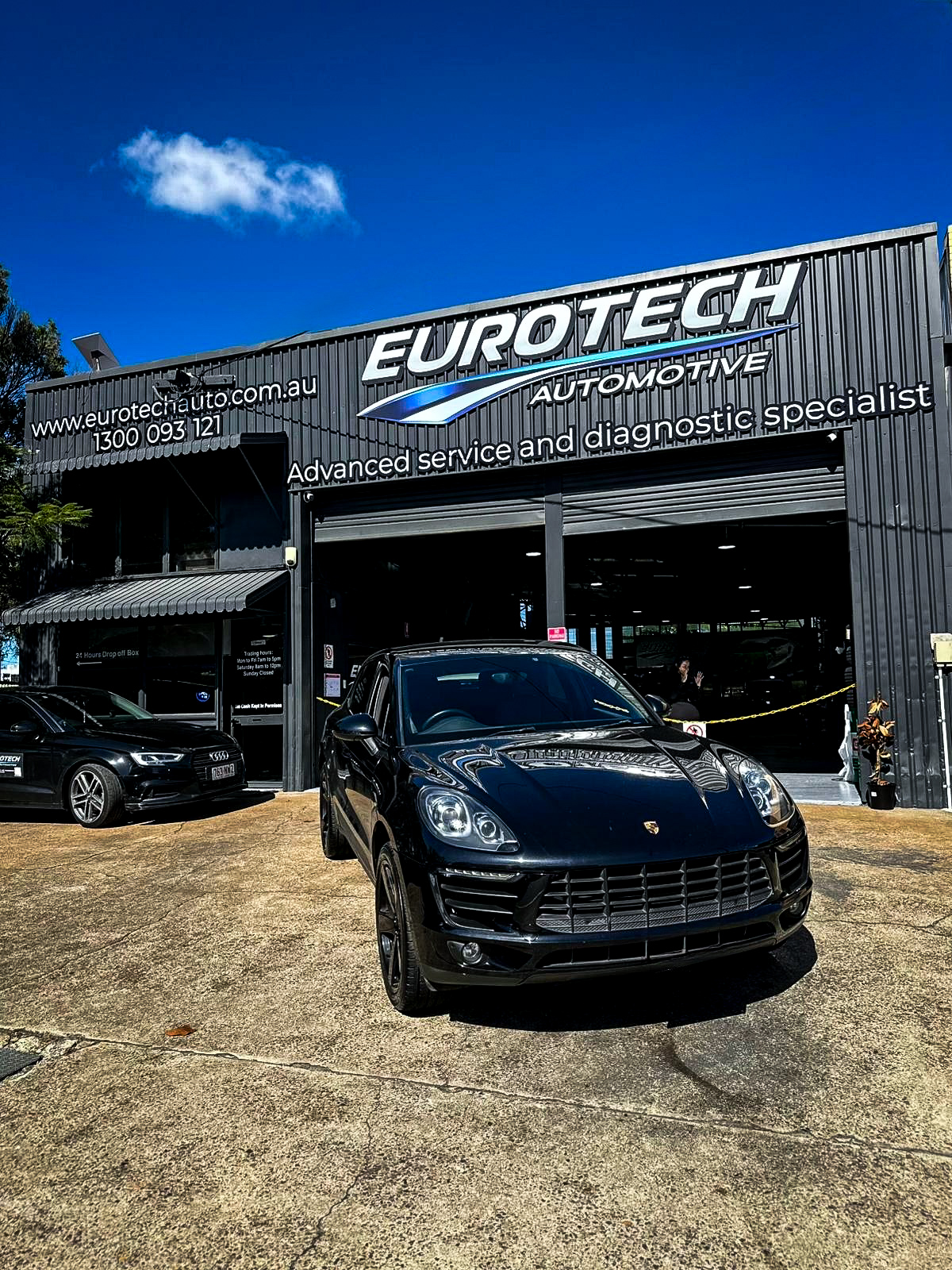 Premium car outside an automotive workshop